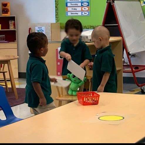 Children interacting with the character Z from Harmony SEL
